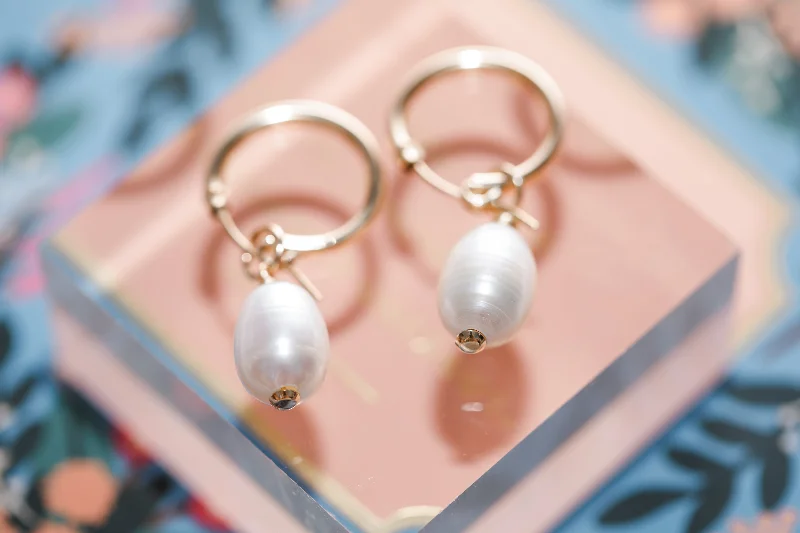 Hoop earrings with crescent moon shapes for a celestial and mystical appearance-large pearl hoops { gold + silver }