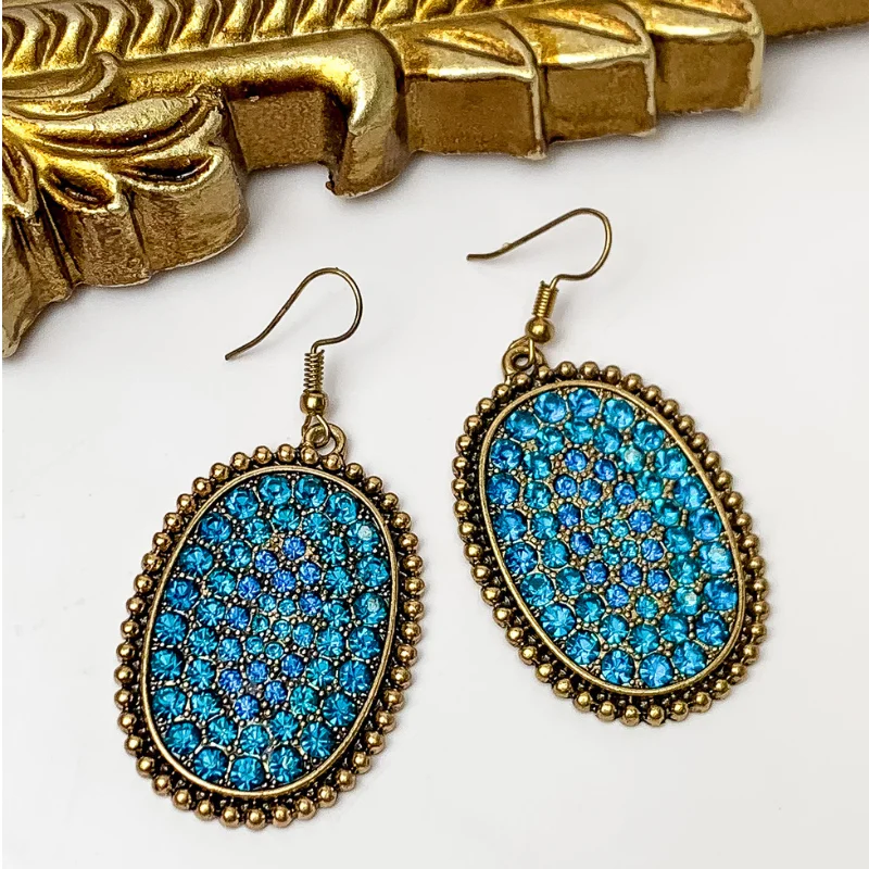 Hoop earrings with diamond-cut surfaces for added sparkle and shine-Oval Jeweled Earrings with Gold Tone Border in Blue