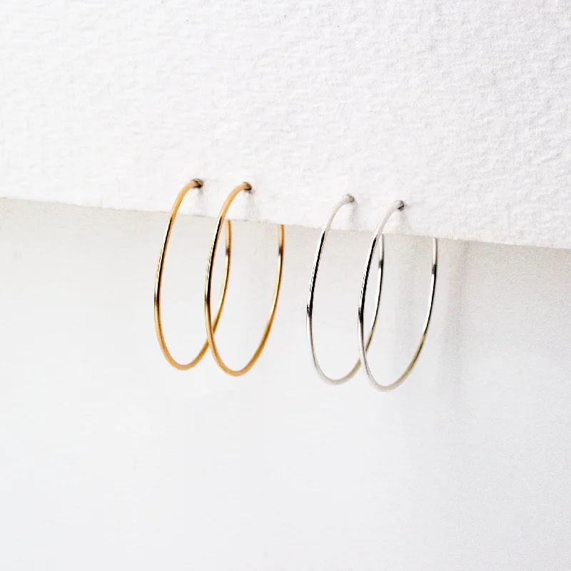 Hoop earrings with polished silver finish for a shiny, modern appeal-Weightless XS Hoops