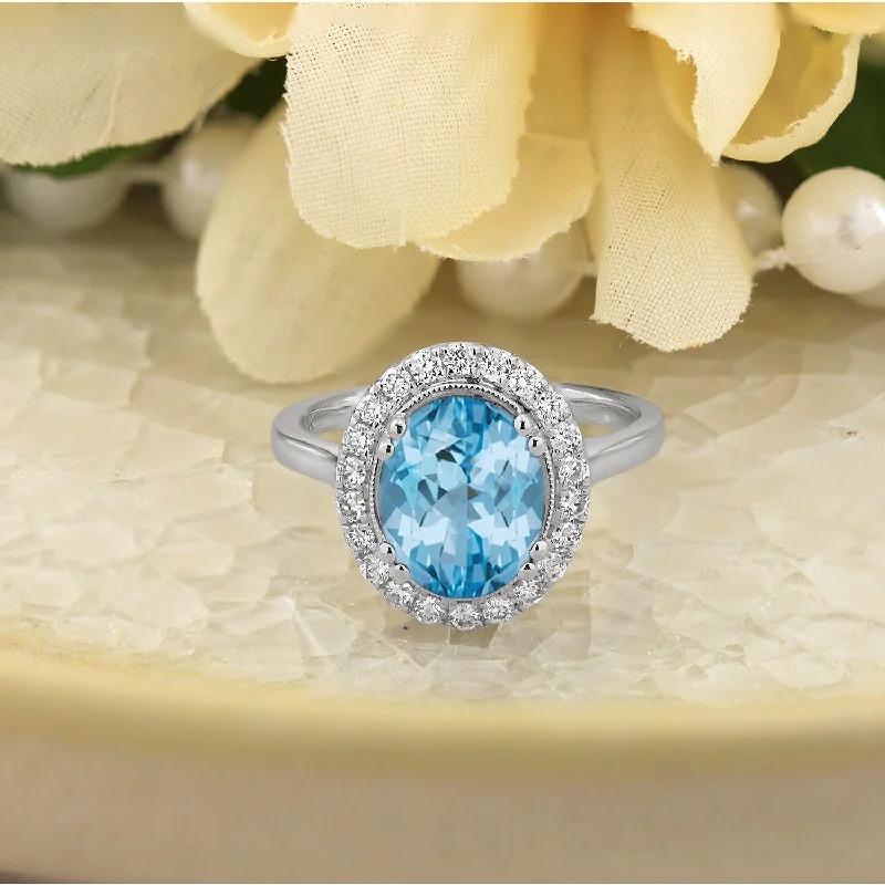 Rings with hexagon-cut stones for trendiness -Auriya Vintage 2 5/8ct Oval Sky Blue Topaz and Halo Diamond Engagement Ring 1/3ctw 14k Gold