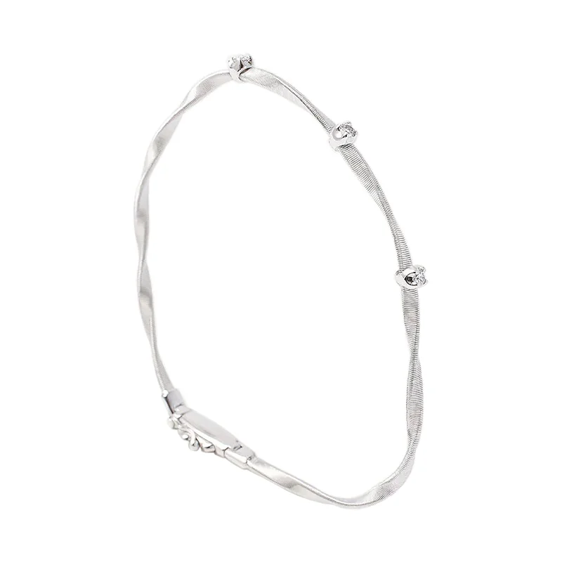 Best bangle bracelets with silver-plated finishes for an affordable and stylish accessory-Marrakech Twisted Coil Bracelet With Diamonds