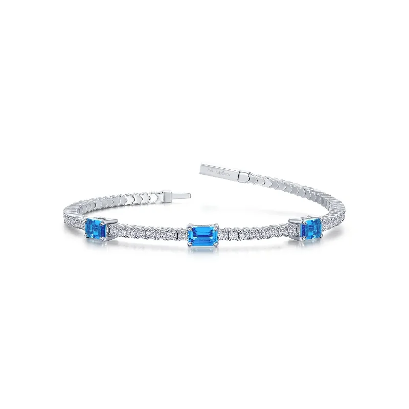 Simple bangle bracelets with smooth matte finishes for a subtle and modern style-Flexible Blue Topaz Station Bracelet in Sterling Silver