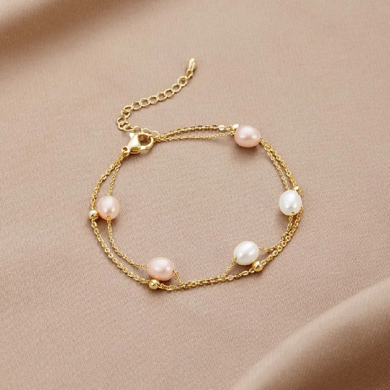 Stacked bangle bracelets with alternating textures for a dynamic, trendy look-Freshwater Pearl Layered Bracelet