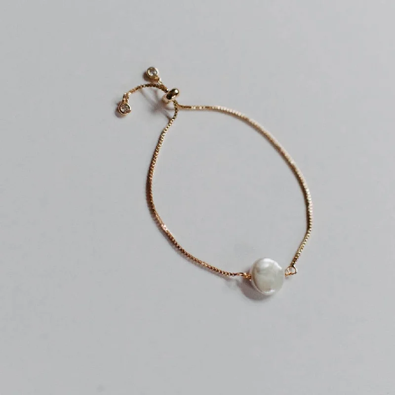 Gold bangle bracelets for women with a minimalist and sleek design-Lucy Adjustable Pearl Bracelet