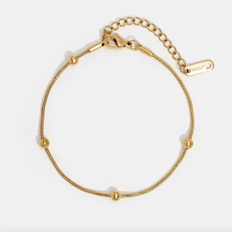 Best bangle bracelets for stacking with delicate and thin designs for layering-Luna Gold Bead Bracelet