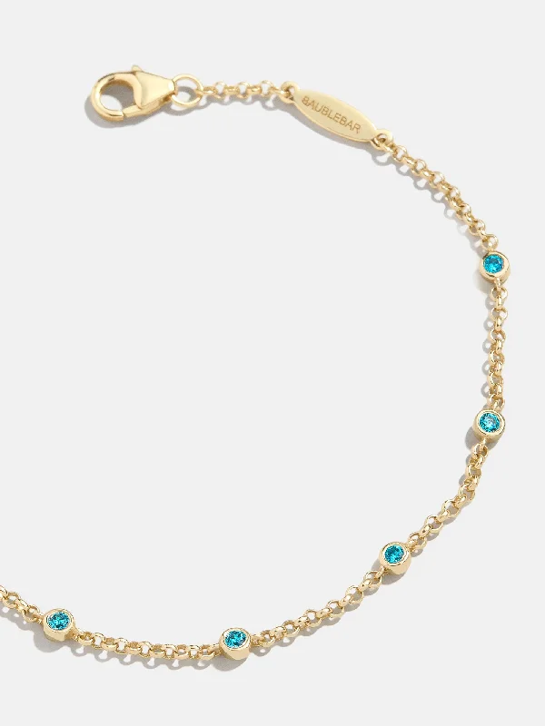 Sleek bangle bracelets with polished titanium for a modern and lightweight option-Yasmine 18K Birthstone Bracelet - Blue Zircon